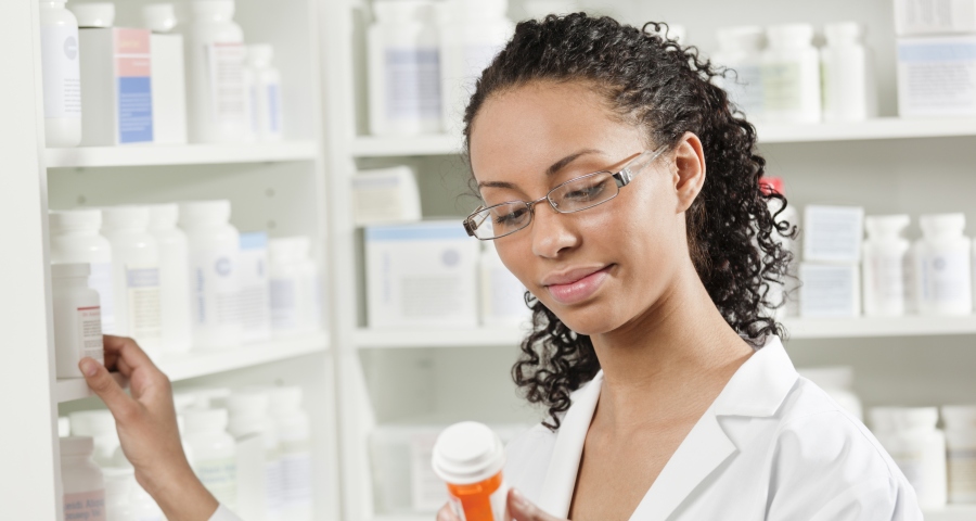 pharmacist checking prescription
