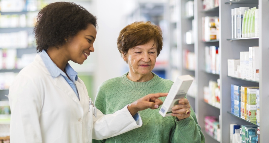 pharmacist assisting customer